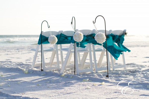 Turquise Sashes on White Chairs with Flower Globes